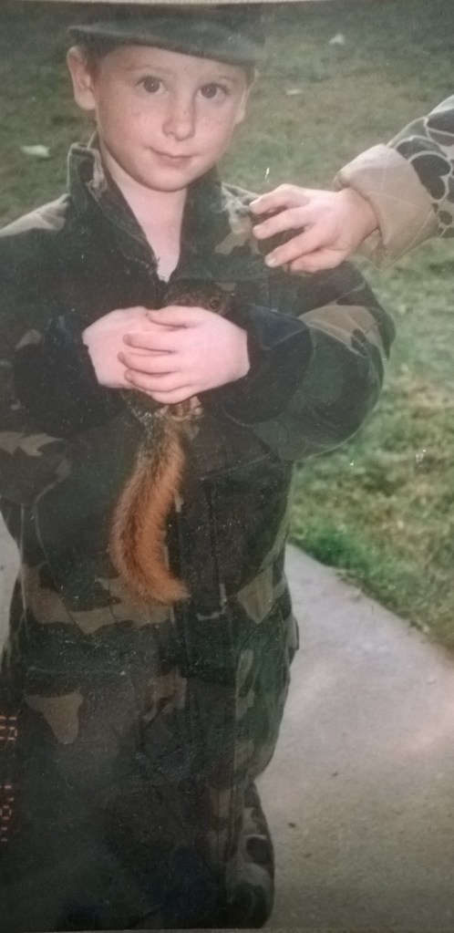 My cousin, about 15 years ago. His dad was in the house getting ready to take him squirrel hunting. Matt just went out in the yard and caught one.